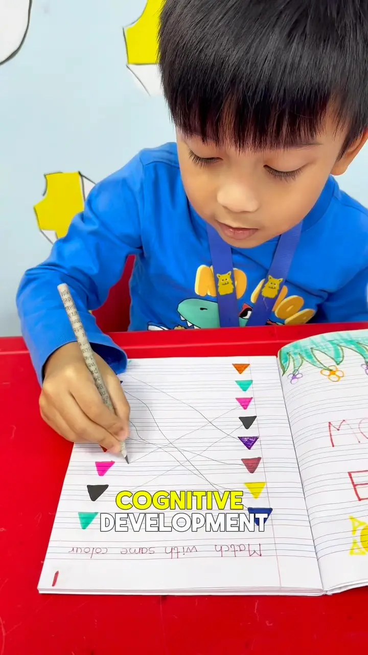 A child completing a colour-matching worksheet