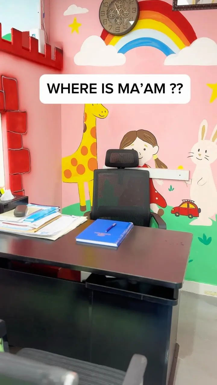 The nursery office with a painted giraffe and rabbit mural